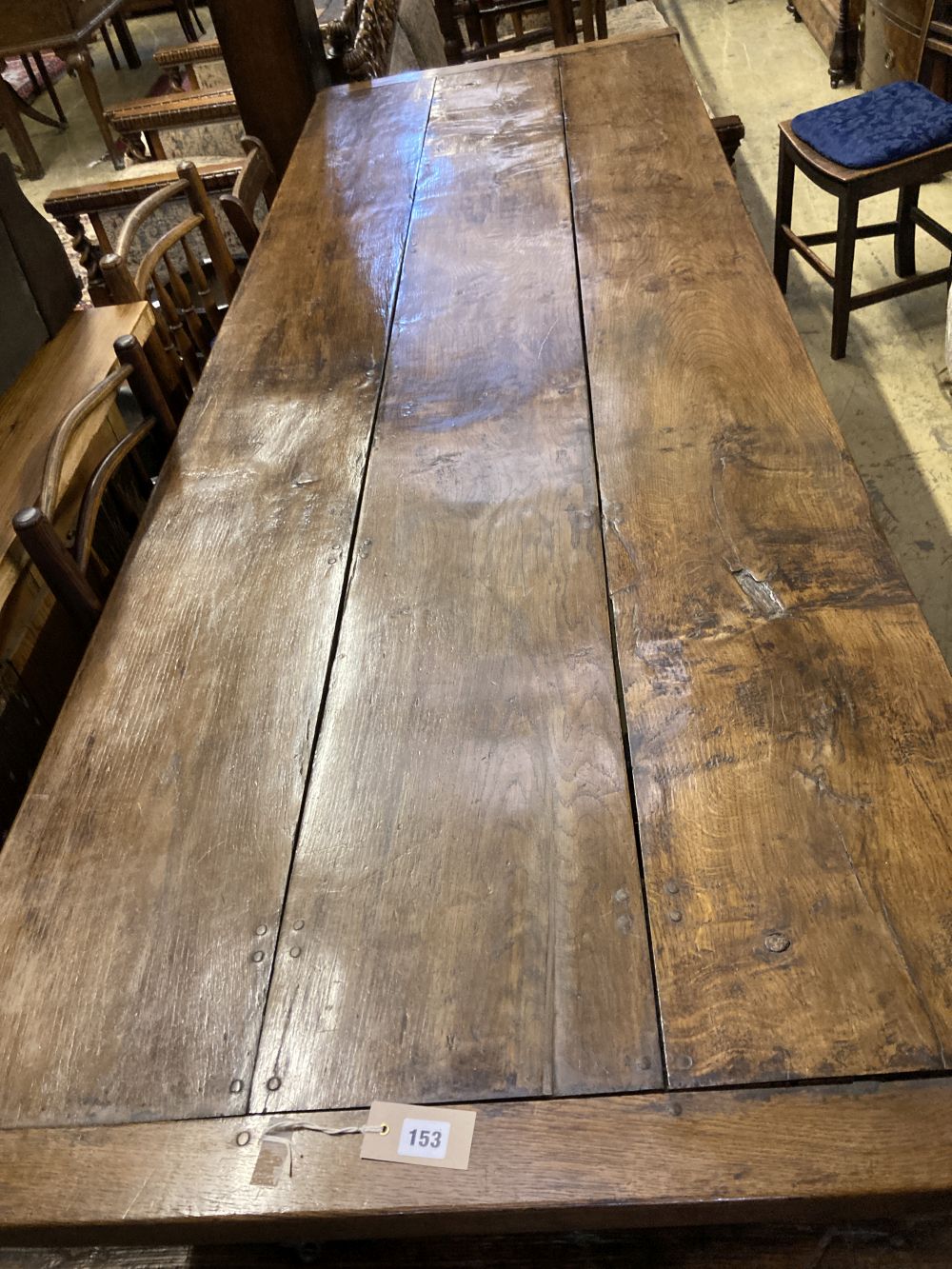 An 18th century style oak refectory dining table, 240 x 83cm height 76cm